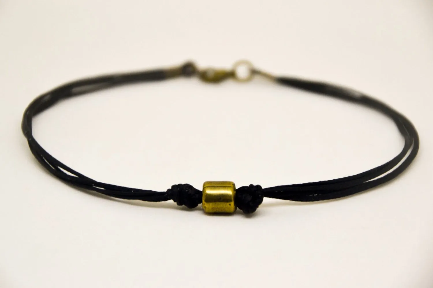 Men's anklet with a bronze tube charm and a black cord, gift for him